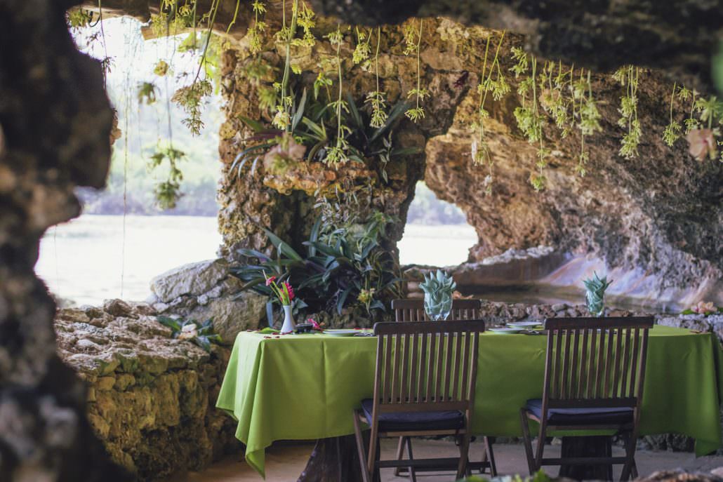 private table setting in seaside grotto decorated with flowers