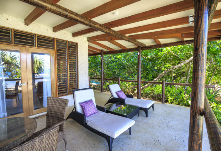 patio of luxury fiji villa with two lounge chairs
